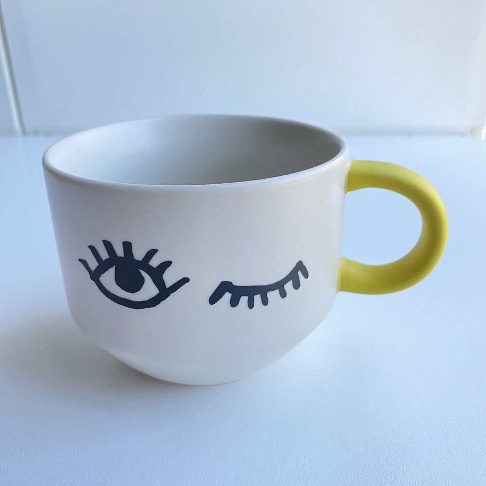 Winking Starbucks Face Mug Tan Yellow Eyes Eyelashes Coffee Cup 14 fl oz Ceramic
